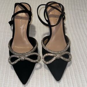 Black and silver bow heels